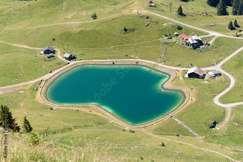 Beautiful lake of Nyon-Guérin located in Morzine, French Alps, Haute-Savoie department, France.