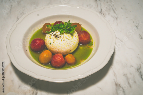 Burrata Tomato Agrodolce Served with marinated peeled cherry tomato and gremolata oil