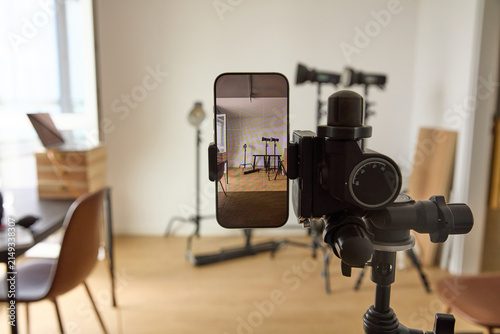 Photography Smartphone mounted on a tripod inside a professional video and photography studi