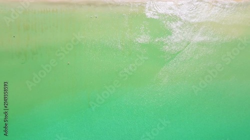 Beautiful sea summer landscape, Waves sea water surface High quality video Bird's eye view, Drone top view waves crashing on sand beach,Nature ocean sea beach background