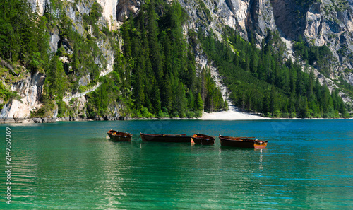 Bild auf Leinwand Boats on the Braies Lake in Dolomites mountains, Italy