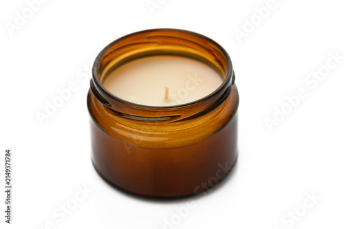 Canvastavla Cozy ambiance created by a softly glowing amber candle on a minimalistic surface
