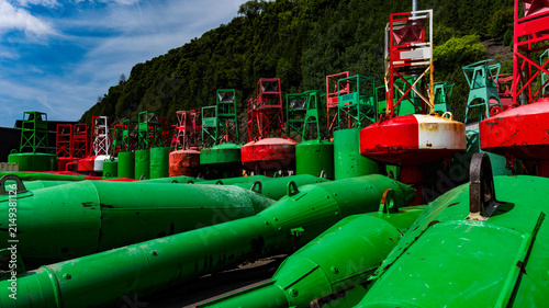 Red and green navigation markers in dry docks