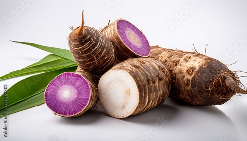 Fresh Taro Root With Purple And Green Ends On A White Background