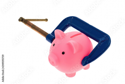 Quadro su tela Pink Piggy Bank Squeezed by a Blue Metal Clamp Representing Financial Pressure