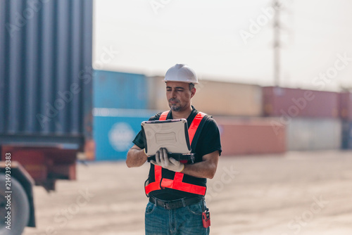 Container yard supervisor directing tank container operations for safe efficient workflow