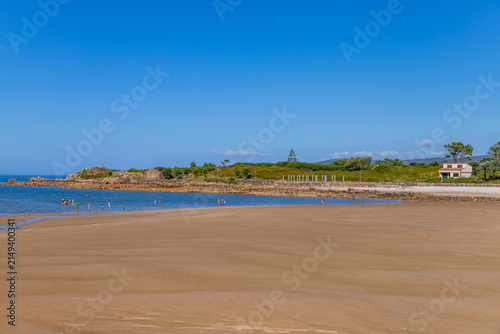 A scenic beach with people near A Coruna