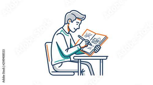 A young man sits at a desk and draws a picture in a sketchbook