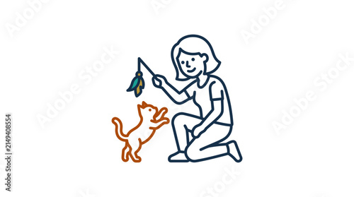 A young woman plays with her small pet cat using a toy