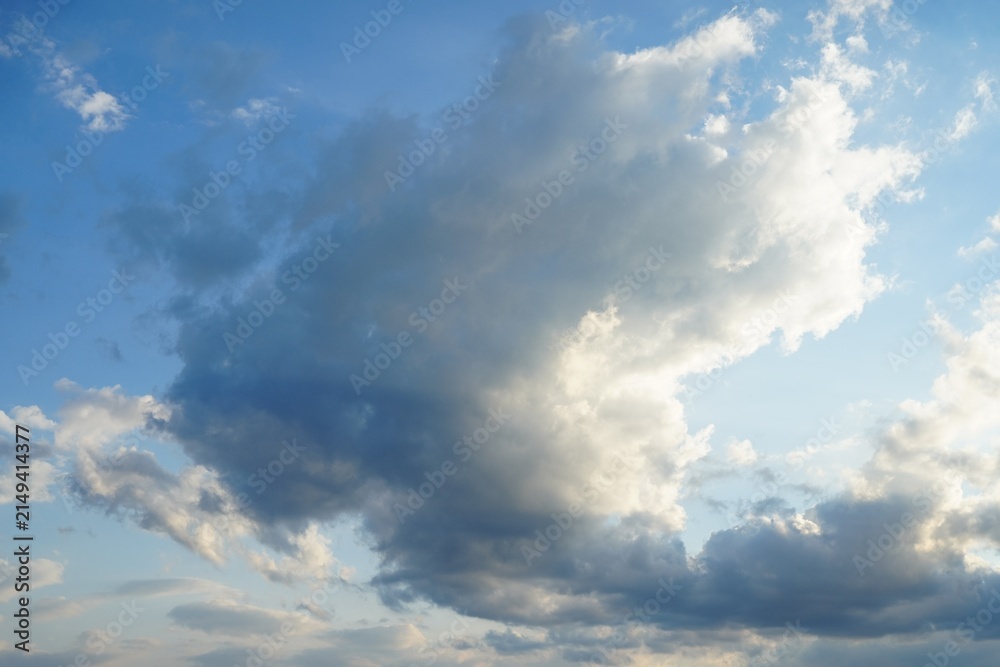 Obraz premium Clouds floating, in sky, with clouds, from a aerial perspective, with blue, white accents, and serene expansive mood, with nearby objects, in surrounding setting.