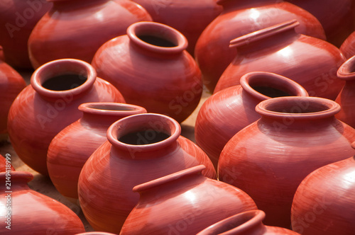 Photography Earthen pot being made using potter's wheel, India