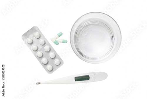 Bild auf Leinwand Healthcare Essentials with Digital Thermometer Blister Pack of Tablets and Glass