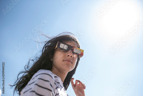 Girl Wearing Protective Glasses for a Solar Eclipse Under Bright Sunlight