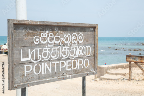 Obraz na płótnie Wooden signboard for Point Pedro in Sri Lanka near coast