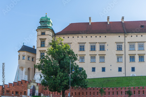 Wawel Royal Castle facade with Senator Tower and medieval brick walls in Krakow, Poland.