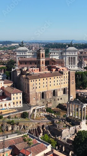 Aerial drone view over the historic center of Rome, Italy, featuring Capitoline Hill, the Altar of the Fatherland and the archaeological area of the Roman Forum. Panoramic view of Rome's historic arch