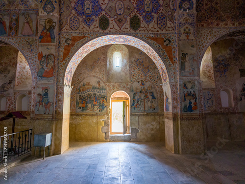 Fotografía Historic church nave with detailed wall paintings and natural light