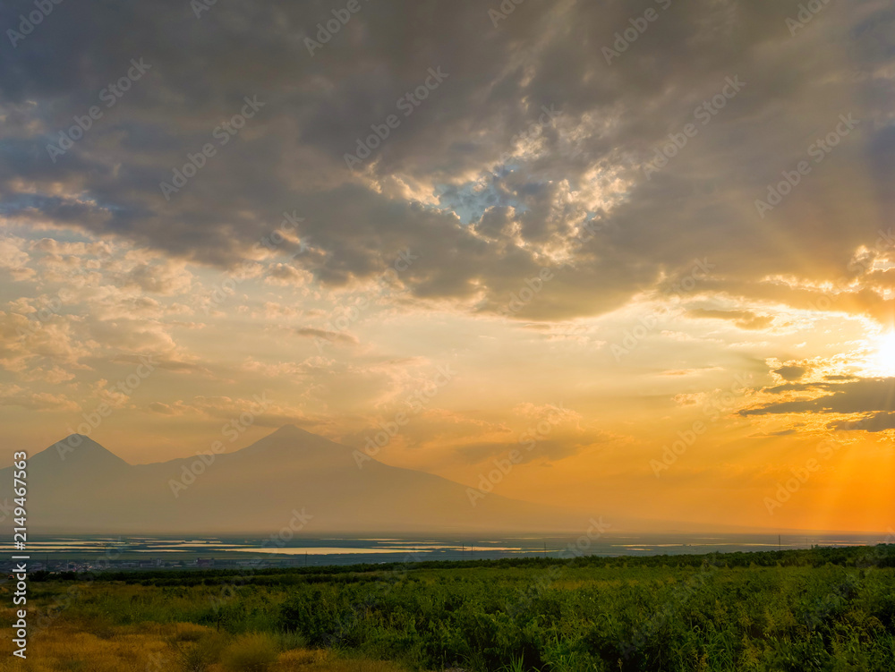 Fototapeta premium Dramatic sunset behind mountain peaks