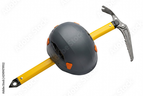 Quadro su tela Ice axe piercing through a grey climbing helmet