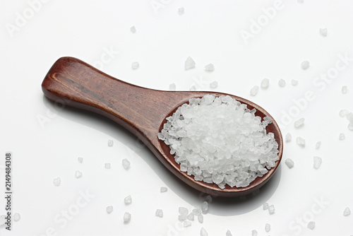 Obraz na płótnie Coarse Sea Salt on spoon isolated on white background