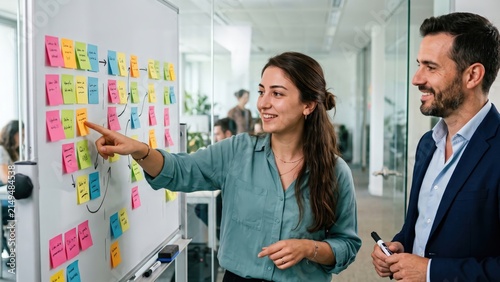 Business Strategy Planning Meeting at Whiteboard – Professional Colleagues Reviewing Project Roadmap with Sticky Notes During Corporate Collaboration and Team Discussion