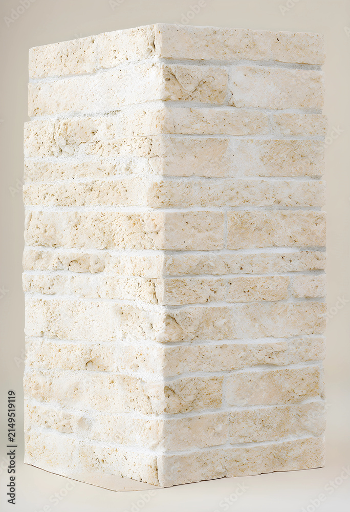 Fototapeta premium Light beige natural stone brick column with rough texture and white mortar, architectural building material, the detailed texture highlights the natural variations and craftsmanship of the stone