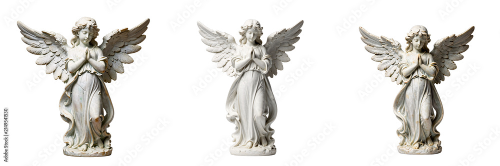 Fototapeta premium Three angel statues on a black background represent religion and spirituality