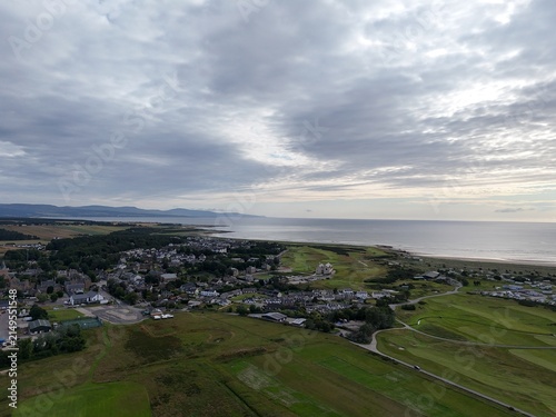 Dornoch is a peaceful Highland town beside the Dornoch Firth, known for its 1224 cathedral, historic castle, blue skies, and sandy shores.