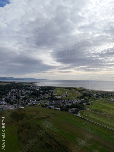 Dornoch is a historic coastal town in Scotland’s Highlands, overlooking Dornoch Firth, with medieval landmarks, golden beaches, dramatic skies, and green landscapes.