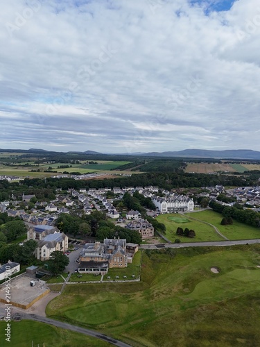 Dornoch is a picturesque Highland town in northern Scotland, featuring a 1224 cathedral, 1509 castle, historic streets, green hills, and changing skies.