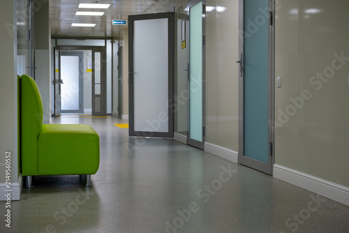 Modern Interior Corridor with Green Chair and Open Doors