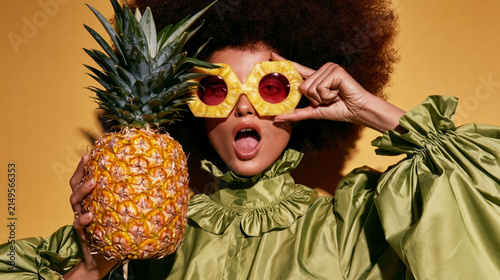 Woman with Pineapple and Fruit-Inspired Sunglasses