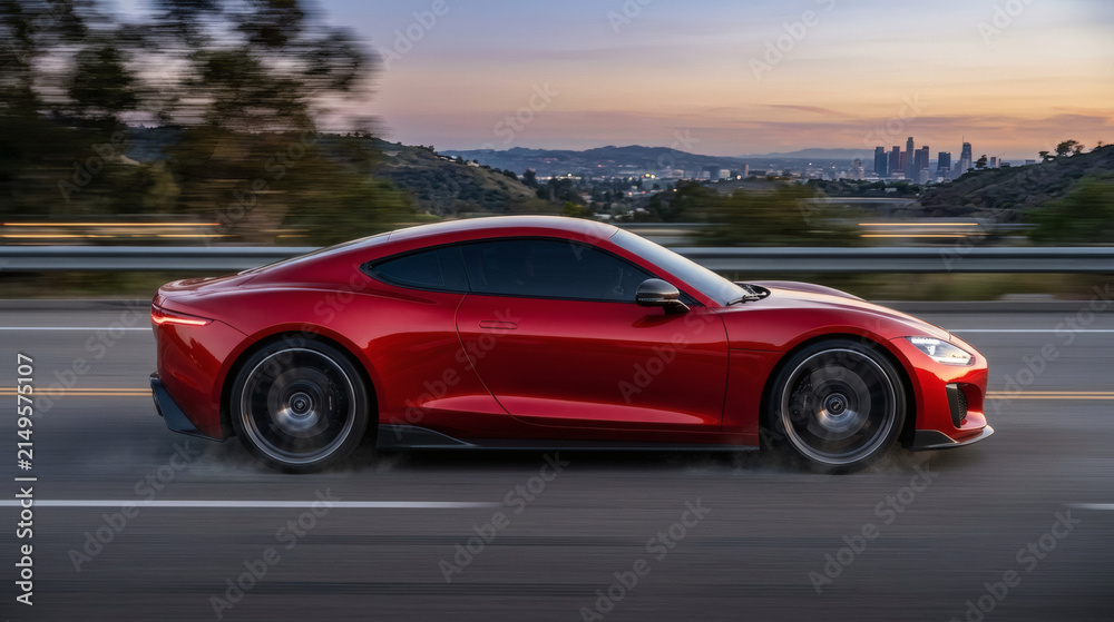 Fototapeta premium Red luxury sports car driving down highway at dusk with city skyline