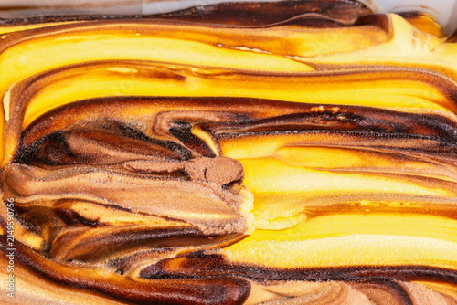 Ice cream dessert with chocolate and orange, fragment close-up
