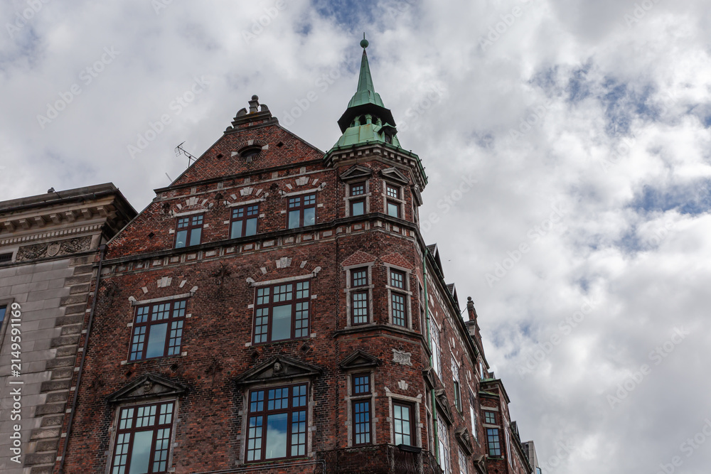 Obraz premium Historic brick building on pedestrian street Stroget in Copenhagen, Denmark