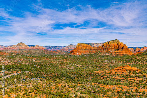 Photography A sweeping view of Sedona's red rock buttes and mesas rises above a green high-desert valley in Arizona