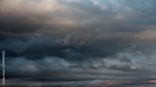 Timelapse of variable dark storm clouds moving across the sky before rainfall with changing weather.