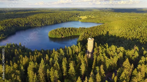 Lookout tower in Finland Hämeenlinna Aulanko in nice summer lighting in aerial drone footage. 