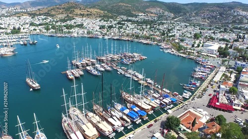 Aerial Bodrum Castle rises above harbor, marina yachts, and gulets on Turkeys Aegean coast.