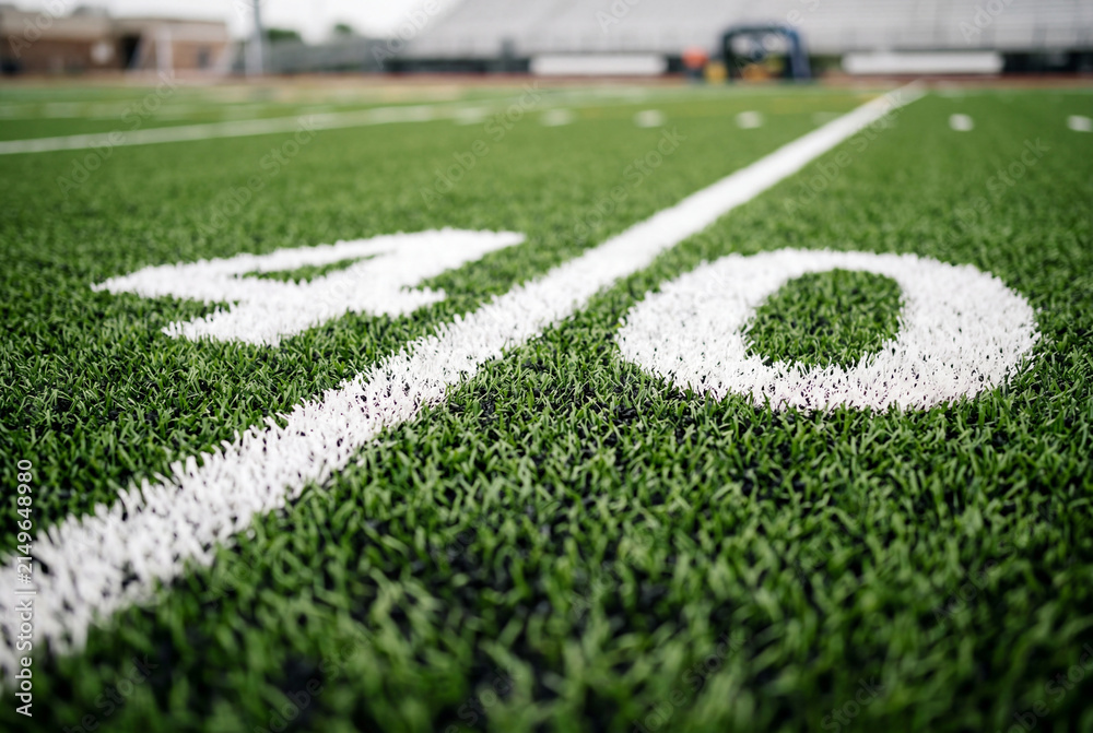 Fototapeta premium Close up of the forty yard line marker on a green artificial turf football field