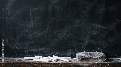 Dusty Chalkboard With Chalk and Eraser — Dark Slate Wooden Tray Closeup