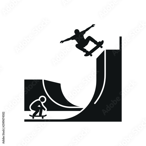 Skateboarder performing trick on ramp silhouette.