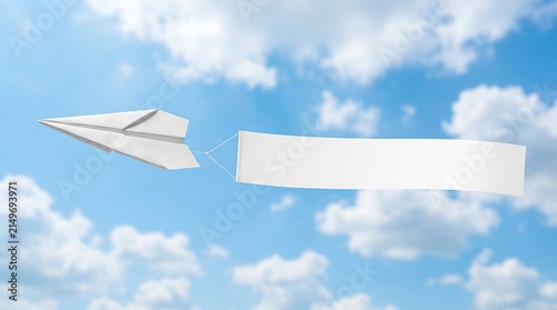 Paper airplane launching a blank banner against a blue sky.