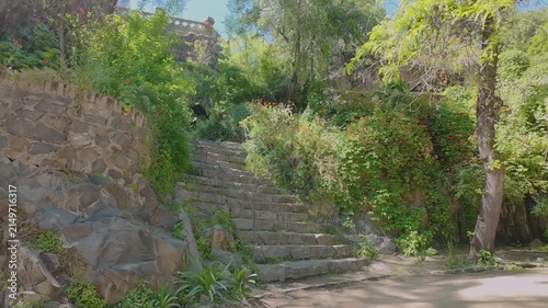Historic Stone Staircase Surrounded by Lush Vegetation at Santa Lucia Hill, Santiago, Chile