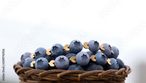 A charm bracelet strung with matte ceramic beads shaped precisely like blueberries, including the subtle indentation and star-shaped blossom end on each bead, in a gradient of dusty blue-purple tones