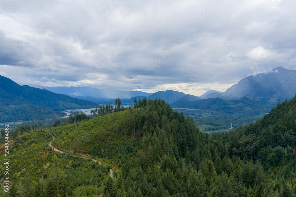 Obraz premium Misty Mountain Valley and Evergreen Forest Overlook Near Harrison Mills, British Columbia, Canada
