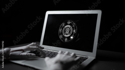 Canvastavla Close-Up View of Robotic Hand Using Laptop with Digital Interface and Business Symbols for Technology Conceptualization