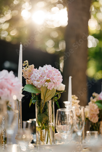 Photography Golden hour illuminates an elegant outdoor table setting, showcasing delicate fl