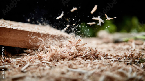 Wood shavings flying from sustainable biomass processing