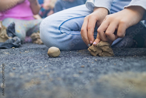 Close-up of Child's Hands Molding Clay in Art Class